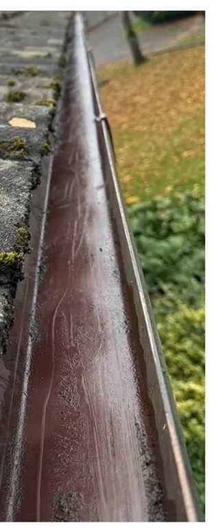 The same gutter emptied with a gutter vacuum